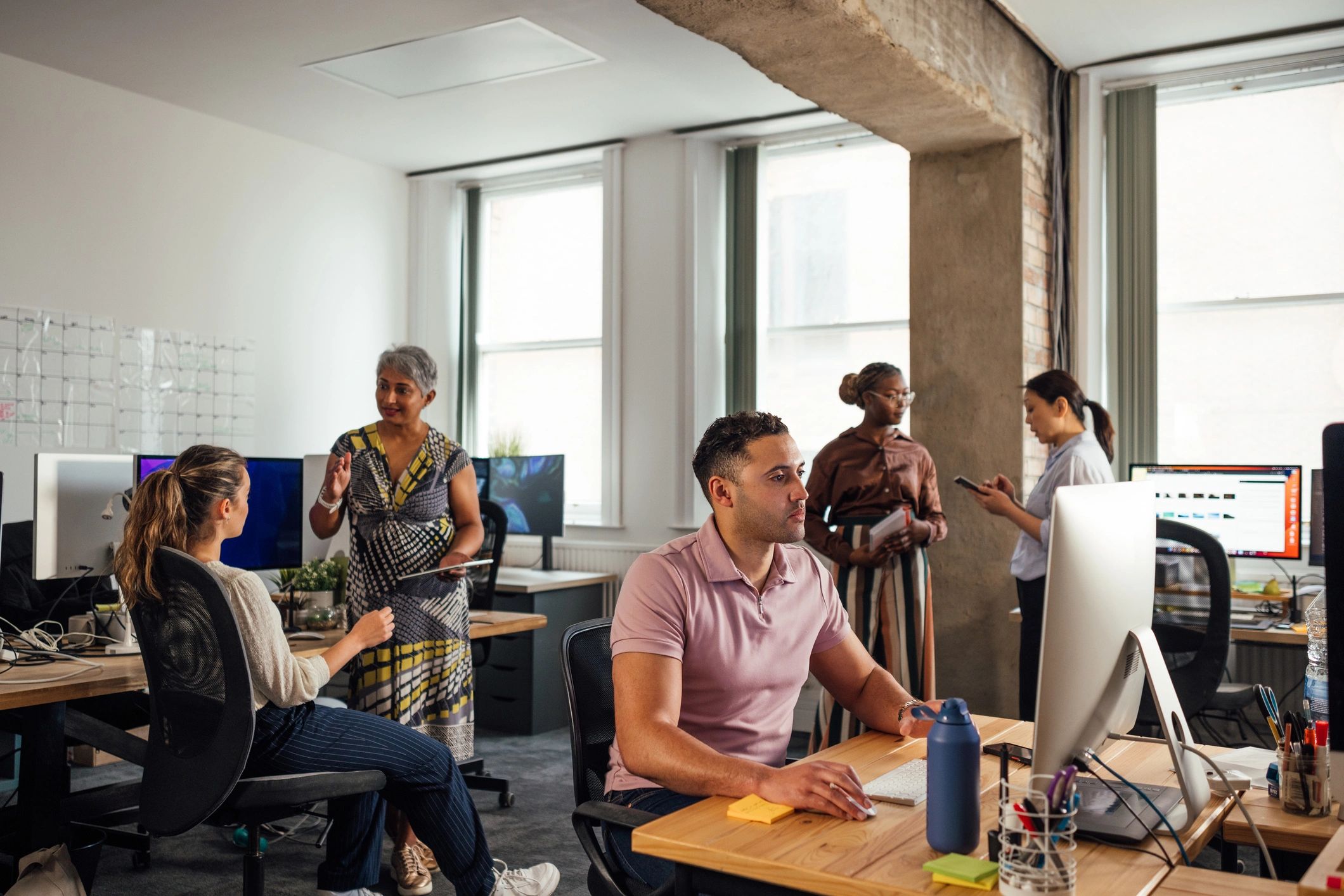 IT support team collaborating in a modern office